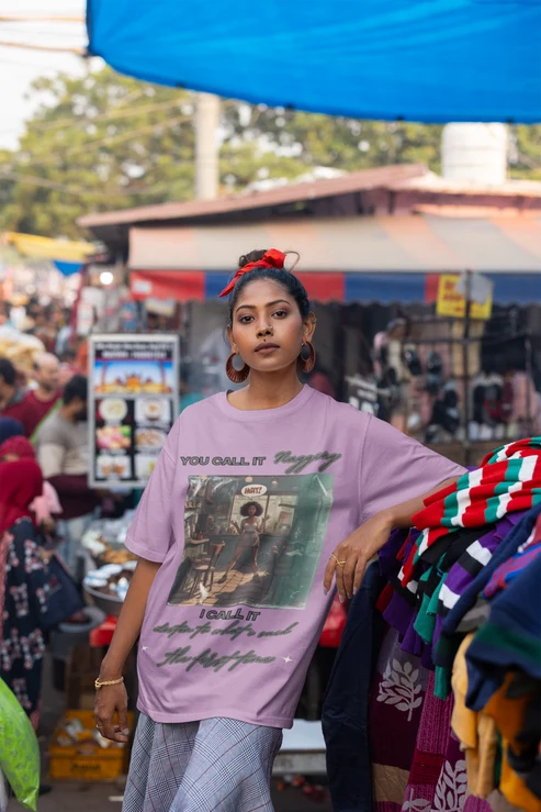 mockup-featuring-a-woman-wearing-an-oversized-blinkstore-t-shirt-at-an-urban-market-m37399.webp
